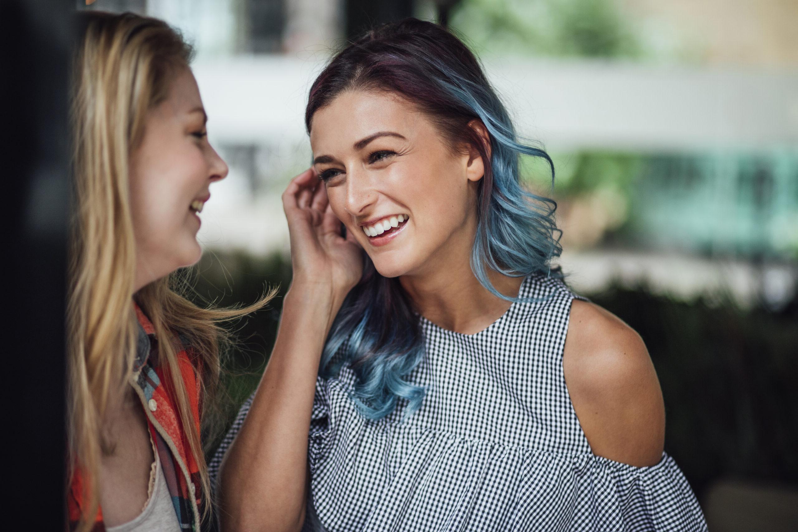 Image of two women speaking to one another